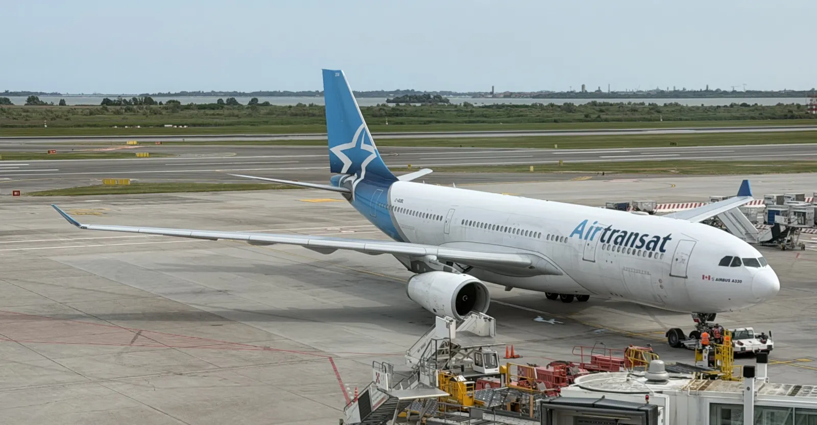 An Airbus A330 widebody parked at the gate